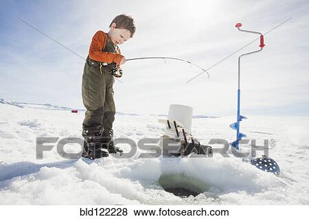 Caucasian boy ice fishing View Large Photo Image Stock Photo - Caucasian boy ice fishing. Fotosearch
