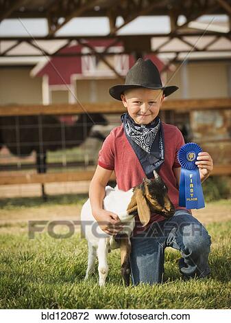 Caucasian boy with prize winning goat on farm View Large Photo Image Stock Image - Caucasian boy with prize winning goat on farm. Fotosearch