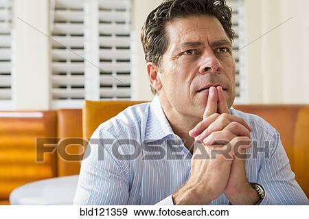 Caucasian businessman sitting in restaurant View Large Photo Image Stock Photo - Caucasian businessman sitting in restaurant. Fotosearch