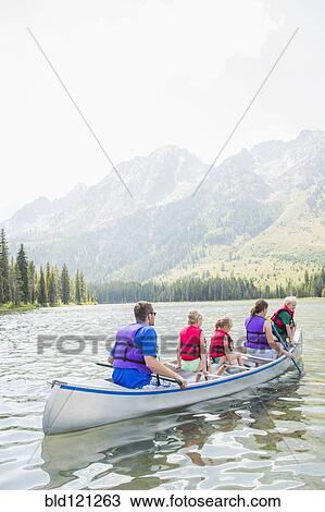 Caucasian family in canoe on lake View Large Photo Image Stock Image - Caucasian family in canoe on lake. Fotosearch