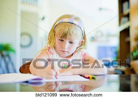 Caucasian girl drawing at table View Large Photo Image Stock Photo - Caucasian girl drawing at table. Fotosearch