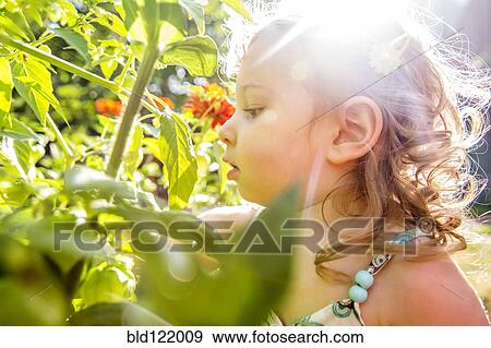 Caucasian girl in garden View Large Photo Image Stock Photo - Caucasian girl in garden. Fotosearch