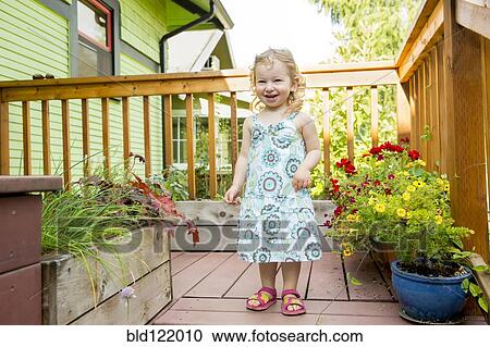 Caucasian girl playing on deck View Large Photo Image Stock Image - Caucasian girl playing on deck. Fotosearch