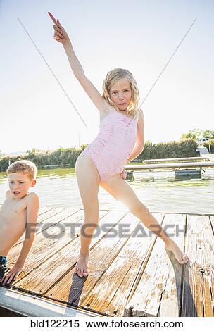 Caucasian girl posing on dock View Large Photo Image Stock Photography - Caucasian girl posing on dock. Fotosearch