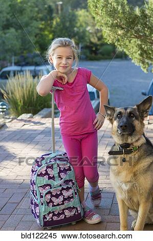 Caucasian girl with suitcase and dog outdoors View Large Photo Image Stock Photography - Caucasian girl with suitcase and dog outdoors. Fotosearch