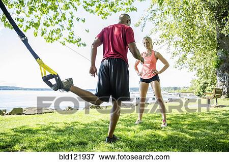 Caucasian man working with trainer outdoors View Large Photo Image Stock Photo - Caucasian man working with trainer outdoors. Fotosearch