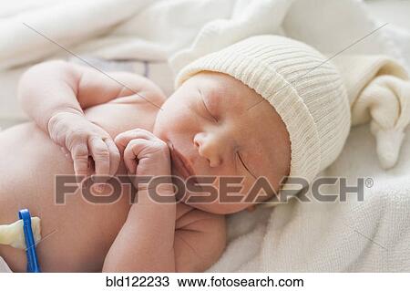 Caucasian newborn baby laying on blanket View Large Photo Image Stock Image - Caucasian newborn baby laying on blanket. Fotosearch