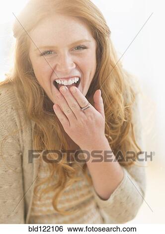 Stock Photograph - Caucasian woman laughing. Fotosearch