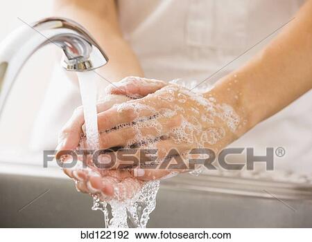 Caucasian woman washing her hands View Large Photo Image Stock Image - Caucasian woman washing her hands. Fotosearch