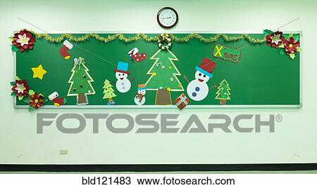 Stock Image - Classroom chalkboard decorated for Christmas. Fotosearch