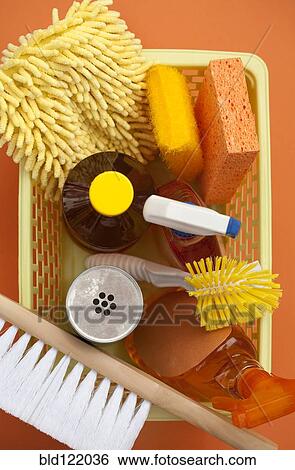 Stock Photograph - Close up of basket of cleaning supplies. Fotosearch
