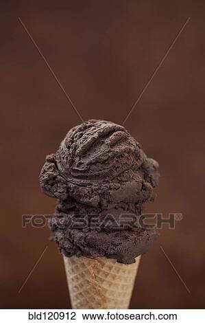Stock Image - Close up of chocolate ice cream cone. Fotosearch