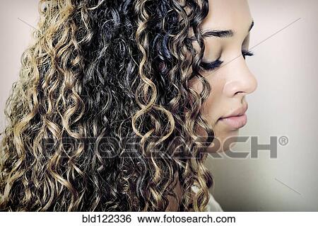 Close up of mixed race girl looking down View Large Photo Image Stock Photograph - Close up of mixed race girl looking down. Fotosearch
