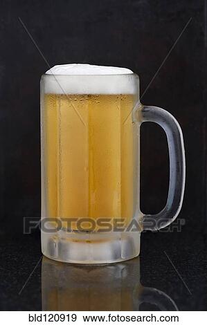 Close up of mug of beer View Large Photo Image Stock Photo - Close up of mug of beer. Fotosearch