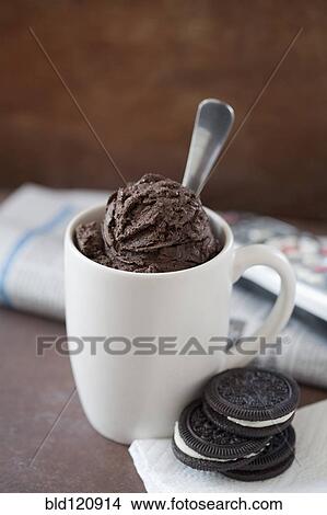 Close up of mug of ice cream and cookies View Large Photo Image Picture - Close up of mug of ice cream and cookies. Fotosearch