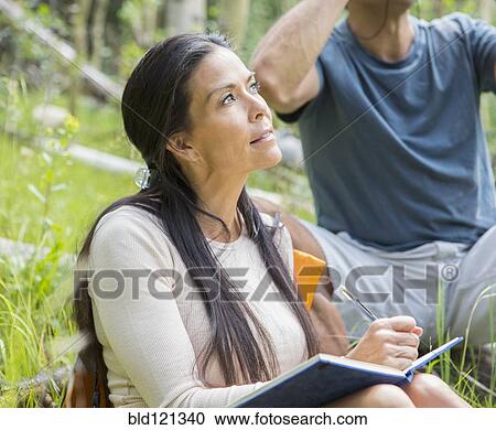 Stock Image - Couple bird watching. Fotosearch