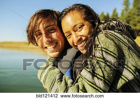 Couple hugging by rural lake View Large Photo Image Stock Image - Couple hugging by rural lake. Fotosearch