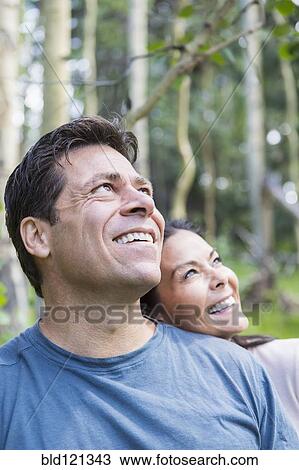 Stock Image - Couple smiling outdoors. Fotosearch