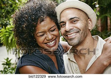 Stock Photo - Couple smiling together outdoors. Fotosearch