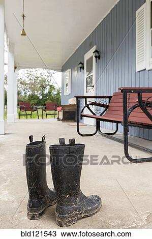 Dirty wellingtons on front porch View Large Photo Image Stock Image - Dirty wellingtons on front porch. Fotosearch