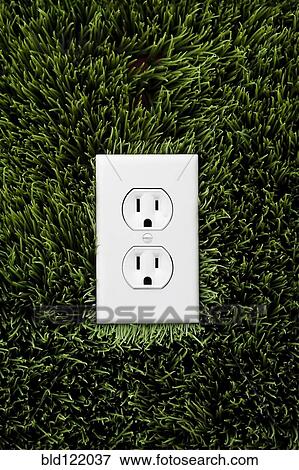 Stock Photo - Electric outlet in grass. Fotosearch