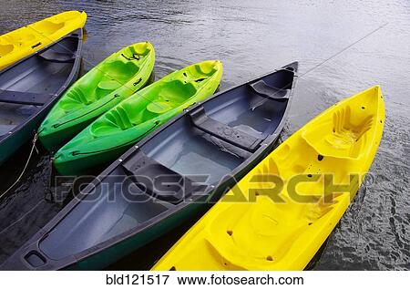 Empty canoes mooring on lake View Large Photo Image Stock Photo - Empty canoes mooring on lake. Fotosearch