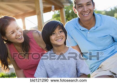 Family smiling outdoors View Large Photo Image Stock Image - Family smiling outdoors. Fotosearch