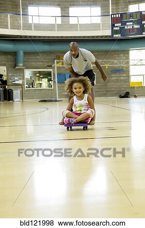 Father and daughter playing on basketball court View Large Photo Image Stock Photo - Father and daughter playing on basketball court. Fotosearch