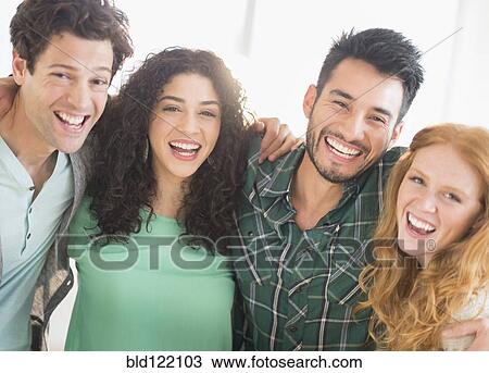 Stock Image - Friends laughing together. Fotosearch