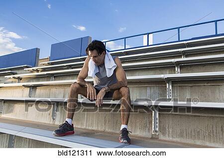 Hispanic athlete resting on bleachers View Large Photo Image Stock Image - Hispanic athlete resting on bleachers. Fotosearch