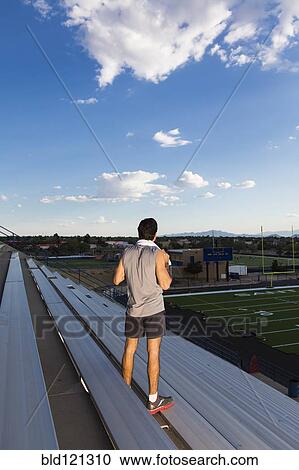Hispanic athlete standing on bleachers View Large Photo Image Stock Image - Hispanic athlete standing on bleachers. Fotosearch