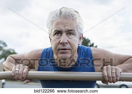 Hispanic man exercising outdoors View Large Photo Image Stock Photograph - Hispanic man exercising outdoors. Fotosearch