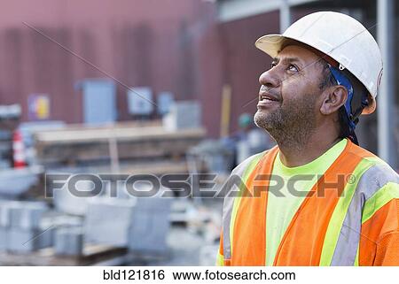 Hispanic worker at construction site View Large Photo Image Stock Photograph - Hispanic worker at construction site. Fotosearch