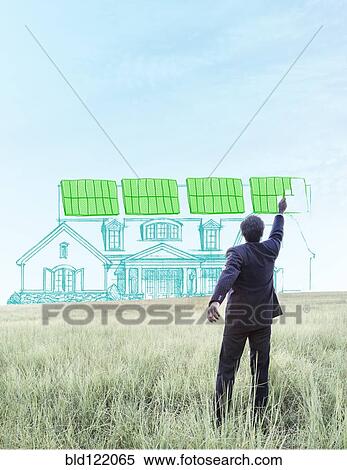 Indian businessman drawing solar panels on home View Large Photo Image Stock Photography - Indian businessman drawing solar panels on home. Fotosearch