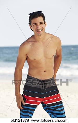Man smiling on beach View Large Photo Image Stock Photo - Man smiling on beach. Fotosearch
