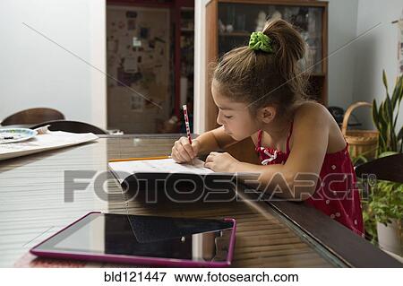 Mixed race girl doing homework View Large Photo Image Stock Photo - Mixed race girl doing homework. Fotosearch