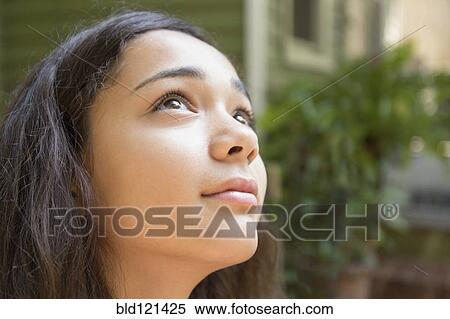 Mixed race girl looking up View Large Photo Image Stock Photography - Mixed race girl looking up. Fotosearch