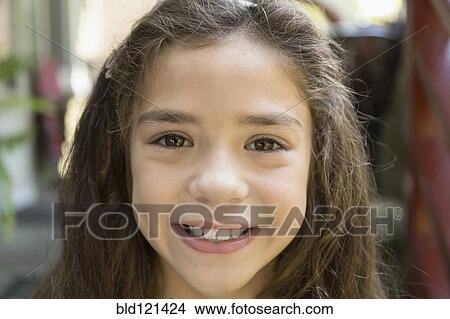 Picture - Mixed race girl smiling. Fotosearch