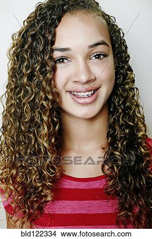 Picture - Mixed race girl smiling. Fotosearch