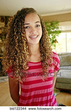 Picture - Mixed race girl smiling. Fotosearch