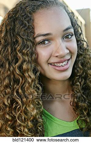 Mixed race girl smiling View Large Photo Image Stock Image - Mixed race girl smiling. Fotosearch