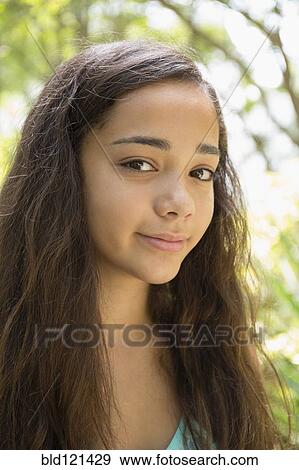 Mixed race girl smiling View Large Photo Image Stock Photo - Mixed race girl smiling. Fotosearch