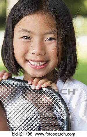 Stock Photo - Mixed race girl smiling. Fotosearch