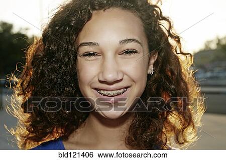 Mixed race girl smiling View Large Photo Image Stock Photograph - Mixed race girl smiling. Fotosearch