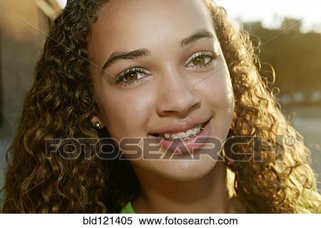 Stock Photography - Mixed race girl smiling. Fotosearch