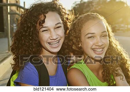 Picture - Mixed race girls smiling. Fotosearch