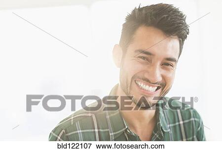 Stock Photo - Mixed race man smiling. Fotosearch