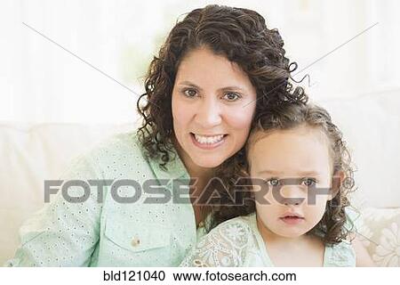 Mixed race mother smiling with daughter View Large Photo Image Stock Image - Mixed race mother smiling with daughter. Fotosearch