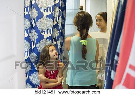 Mixed race sisters in bathroom View Large Photo Image Stock Image - Mixed race sisters in bathroom. Fotosearch