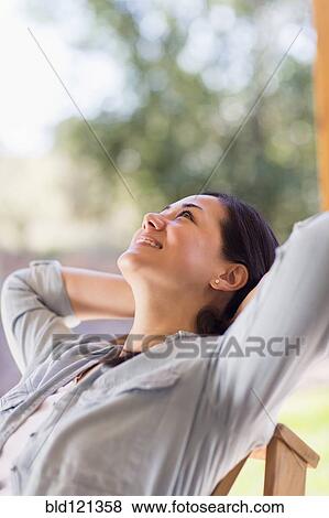 Mixed race woman relaxing indoors View Large Photo Image Stock Photo - Mixed race woman relaxing indoors. Fotosearch